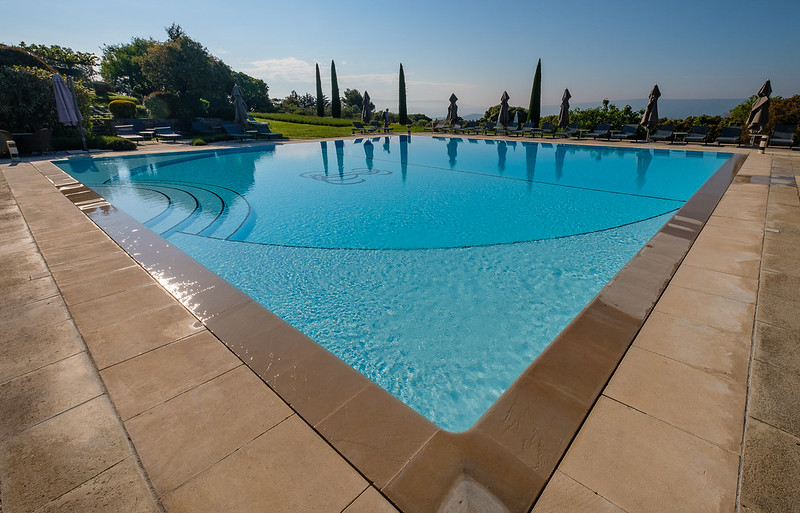3 Reasons to Get a One-Time Pool Cleaning Service During Your Vacation -  Aquanomics Pools